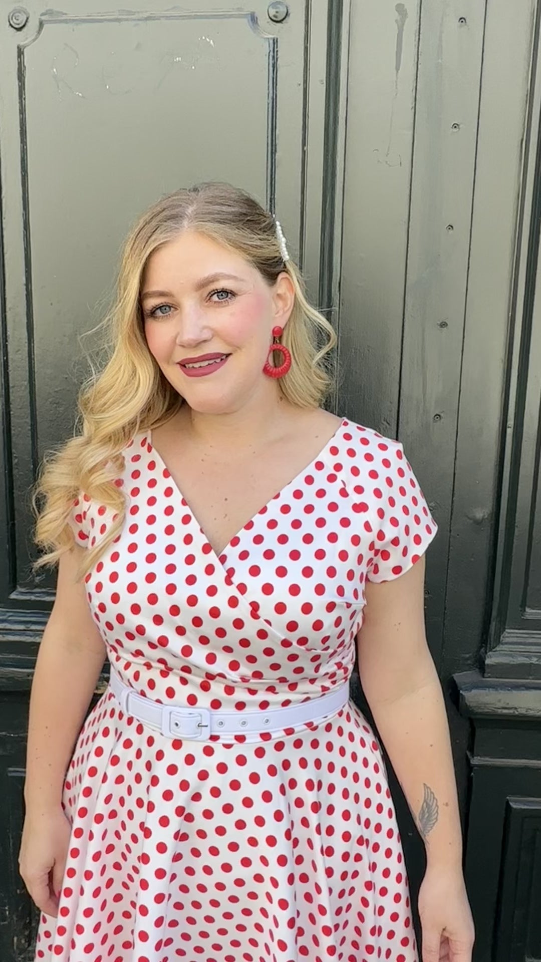 pink and white polka dot dress Hourglass swing dress in white with red polka dots from Pretty Dress Company